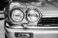 Closeup of the headlights and front bumper on vintage automobile Royalty Free Stock Photo