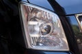 Closeup headlights of modern black car Royalty Free Stock Photo