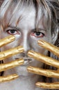 Closeup headshot silver woman with gold fingers