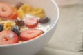 Closeup of healthy breakfast with corn flakes and berries in white bowl Royalty Free Stock Photo