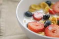 Closeup of healthy breakfast with corn flakes and berries in white bowl Royalty Free Stock Photo