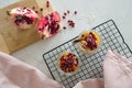 Closeup of healthy breakfast jars with mango puree mixed with chia seeds and pomegranate