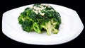 Closeup of healthy broccoli stir fry isolated on black background , chinese cuisine Royalty Free Stock Photo