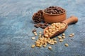 Closeup on healthy and tasty pine nuts in wooden rustic bowl with wood scoop and cedar bump