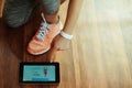 Closeup on woman using online coaching fitness app in tablet PC Royalty Free Stock Photo