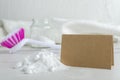 Closeup of heap of baking soda, empty paper card for text, cleaning brush, glass jar full of soda and white wiping towel.Empty spa Royalty Free Stock Photo