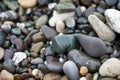 Closeup of a heap of colorful pebbles.