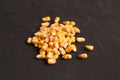 Closeup of a heap of corn grain isolated on a black background Royalty Free Stock Photo