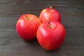 Closeup heap of fresh ripe red apple on black wooden backdrop Royalty Free Stock Photo