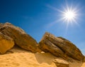 Closeup heap of huge stones on sand under a sparkle sun Royalty Free Stock Photo