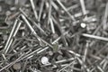 Closeup of heap of nails lying around, India. Royalty Free Stock Photo