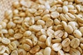 Closeup heap of parchment coffee beans before roasting