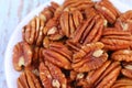 Heap of Pecan Nuts on a White Plate Royalty Free Stock Photo