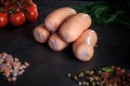 closeup heap of thick short sausages with dill and tomatoes Royalty Free Stock Photo