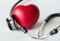 Closeup of heart and a stethoscope cardiovascular checkup concept Royalty Free Stock Photo
