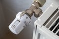 Closeup of heating radiator valve for comfortable temperature regulation on metal radiator on inrerior wall