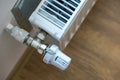 Closeup of heating radiator valve for comfortable temperature regulation on metal radiator on inrerior wall