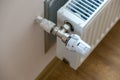 Closeup of heating radiator valve for comfortable temperature regulation on metal radiator on inrerior wall