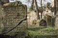 Closeup of Hebrew engravings on an old stone in a graveyard under the sunlight Royalty Free Stock Photo