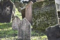 Closeup of Hebrew engravings on old stones in a graveyard under the sunlight Royalty Free Stock Photo