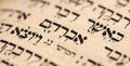 Closeup of hebrew word Abraham in Torah page. Selective focus. Banner Royalty Free Stock Photo