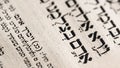Closeup of hebrew word in Torah page that translates in english as Adam, Biblical figure. First man in the Garden of Eden.