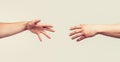 Closeup. Helping hand outstretched, arm, salvation. Close up help hand. Two hands, helping arm of a friend