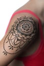 Closeup henna tattoo on woman`s shoulder