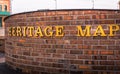 Closeup of heritage map words on a brick wall Royalty Free Stock Photo