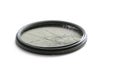 Closeup high angle studio shot of black circular polarizer filter with cracked glass, isolated on white background