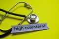 Closeup high colesterol with stethoscope concept inspiration on yellow background Royalty Free Stock Photo