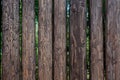 Closeup high wooden fence of logs in countryland Royalty Free Stock Photo