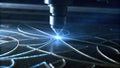 Closeup of a highpowered laser beam being used to etch precise patterns on a glass substrate illuminating the workspace Royalty Free Stock Photo