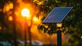 A closeup of a hightech solar panel attached to a lamp post capturing the suns rays to power the nearby streetlight