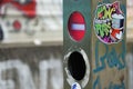 Closeup of a hip-hop sticker on a stop column of an escalator at the A40 motorway