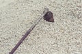 Closeup of a hoe in the stones.