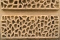 Closeup hole decoration brick wall sandstone background Royalty Free Stock Photo