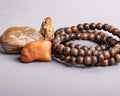Closeup of holistic stones and bracelet isolated in gray background Royalty Free Stock Photo