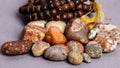 Closeup of holistic stones and bracelet isolated in gray background Royalty Free Stock Photo