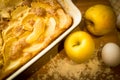 Closeup of homemade apple pie and fresh apples on wooden board Royalty Free Stock Photo