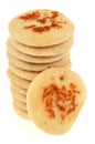 Blinis stacked in closeup on white background