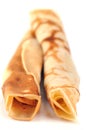 Crepes rolled in closeup on white background Royalty Free Stock Photo