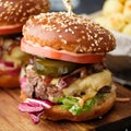 Closeup of Homemade delicious juicy burger with beef, cheese, to Royalty Free Stock Photo