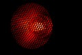 Closeup honeycomb grid texture with red light. Red and dark metal hexagon shaped pattern abstract background. Light modifier