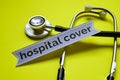 Closeup Hospital Cover with stethoscope concept inspiration on yellow background