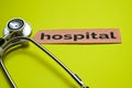 Closeup Hospital with stethoscope concept inspiration on yellow background