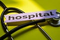 Closeup hospital with stethoscope concept inspiration on yellow background