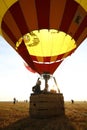 Closeup of hot air balloons being prepared for flight