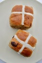 A closeup of hot cross buns on a plate in vertical format Royalty Free Stock Photo