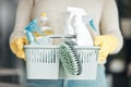 Closeup of house cleaning supplies, floor scrubbing and washing tools or products in an organized basket. Cleaner Royalty Free Stock Photo